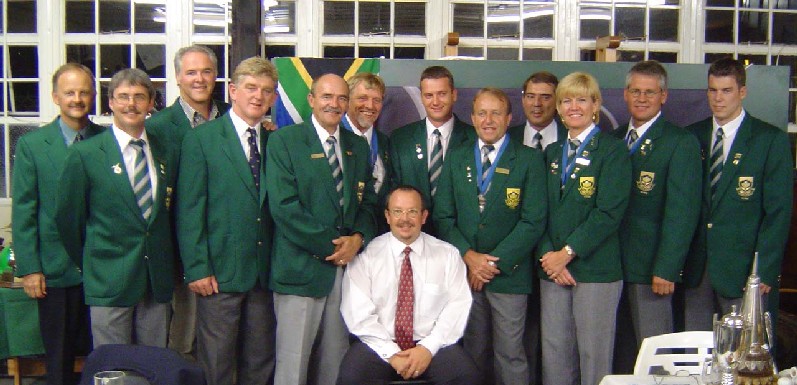 2004 SA Rally and Precision Team - click to enlarge Hugo Stark, Jan Hanekom, Mike Ehrman, Ernie Alexander, Ron Stirk, Hans Schwebel, Neil Delport (Seated/Sponsor), Quentin Taylor, Barry de Groot, Frank Eckard, Mary de Klerk, Dale de Klerk and Nigel Hopkins (Absent - Walter Walle) - 2004 SA Rally and Precision Team